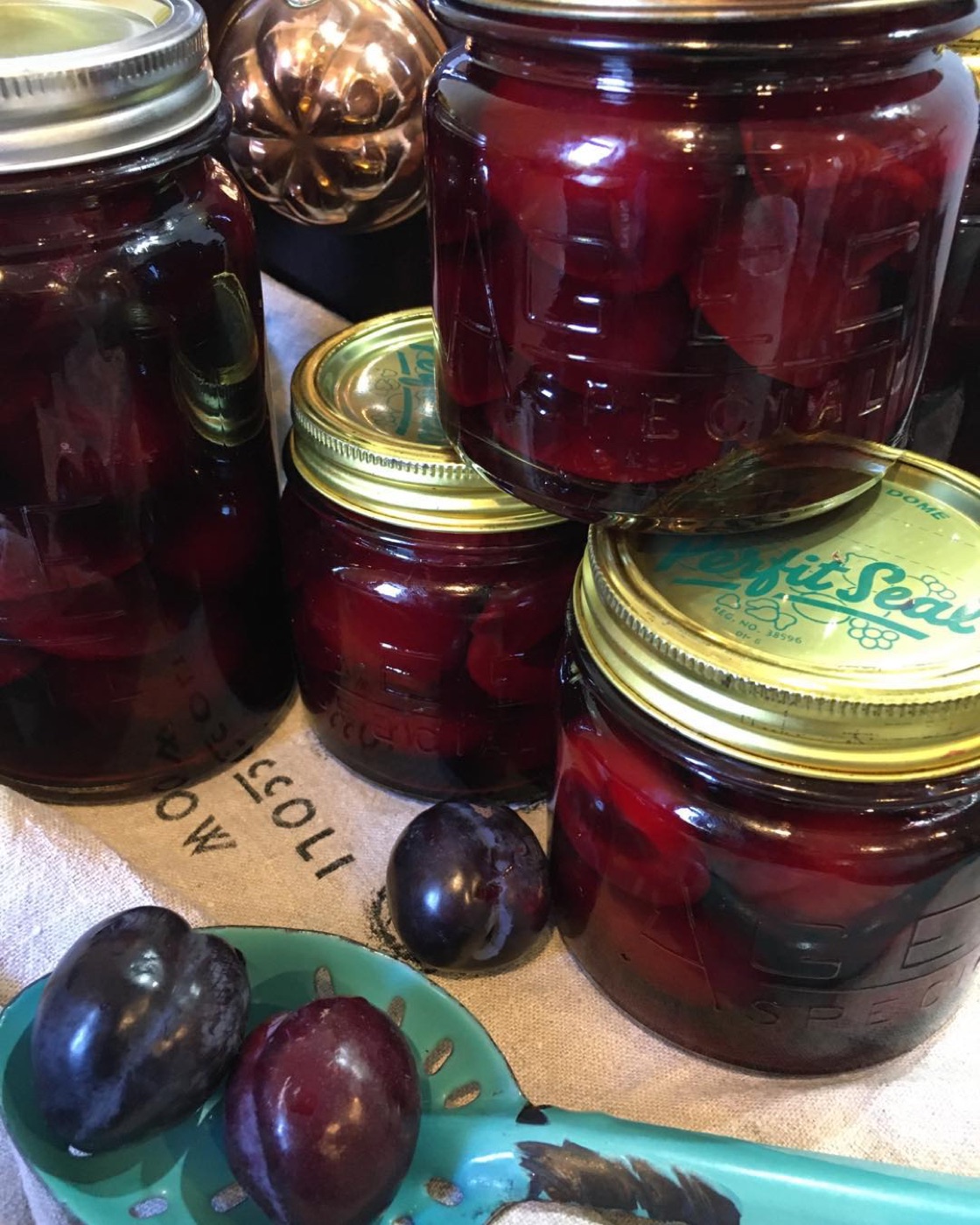 Jars of bottled beetroot and plums